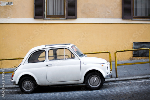 Compact car parked on a small uphill Italian street © Sascha Burkard
