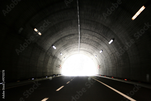 Car lights trails in a tunnel photo