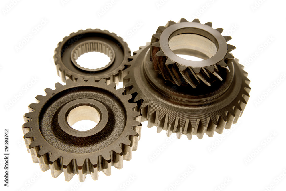 Three gears meshing together over white Three gears meshing together over white