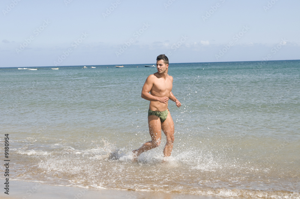 man running in the seaside under the sun man running in the seaside under the sun