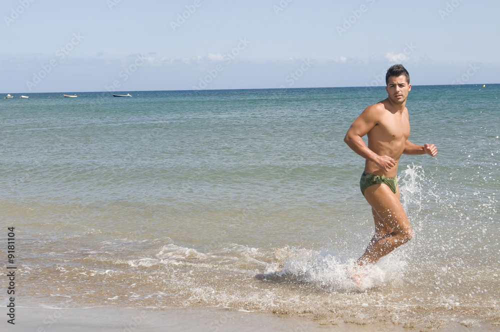 man running in the seaside under the sun man running in the seaside under the sun