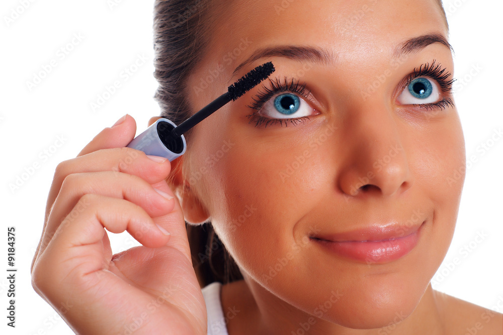 Beatifull woman paints eyelashes Beatifull woman paints eyelashes