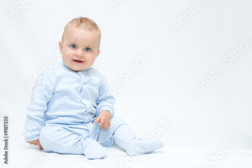 cute baby boy smiling happily on white background