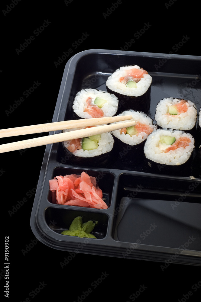 Rolls of sushi on a plate with chopsticks. Rolls of sushi on a plate with chopsticks.