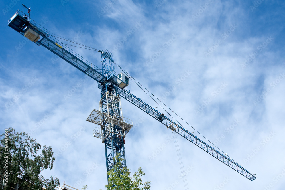 Building tower crane on the sky background
