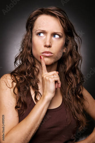 woman remember something and looking up