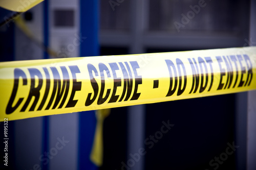 Close up crime scene investigation police boundary tape