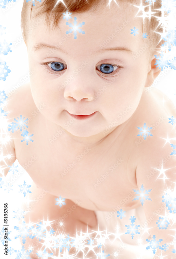 bright picture of crawling baby boy with snowflakes bright picture of crawling baby boy with snowflakes