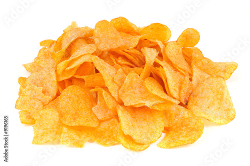 Heap of fried potato chips on white background.