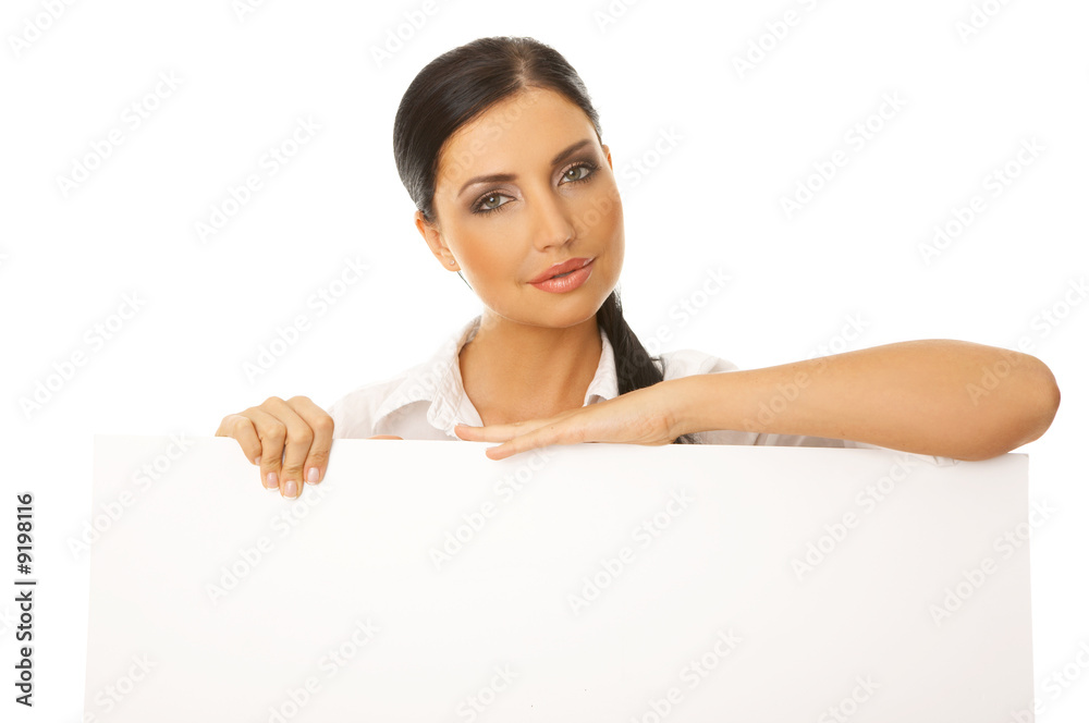 Beautiful business woman holding empty white board Beautiful business woman holding empty white board