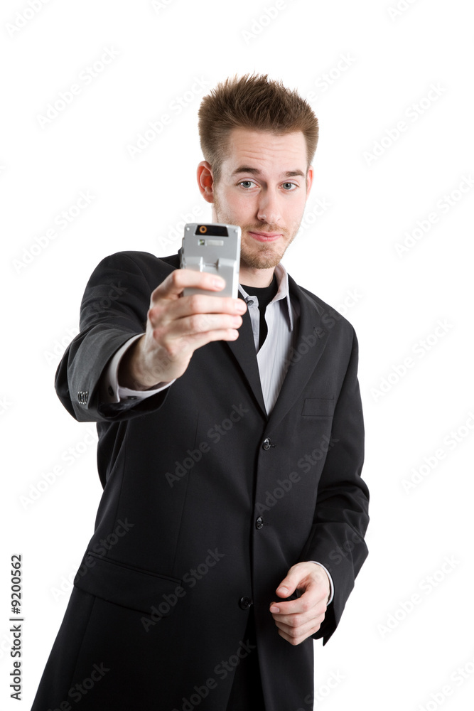 A caucasian businessman taking picture with his camera phone