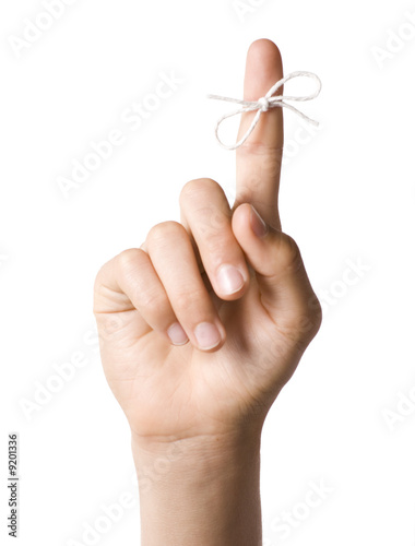 Right hand with reminder string tied to index finger