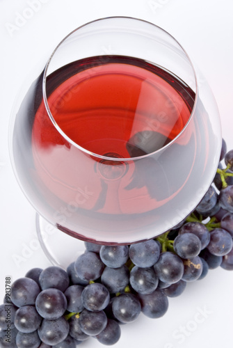 Glass of Red Wine and Purple Grapes
