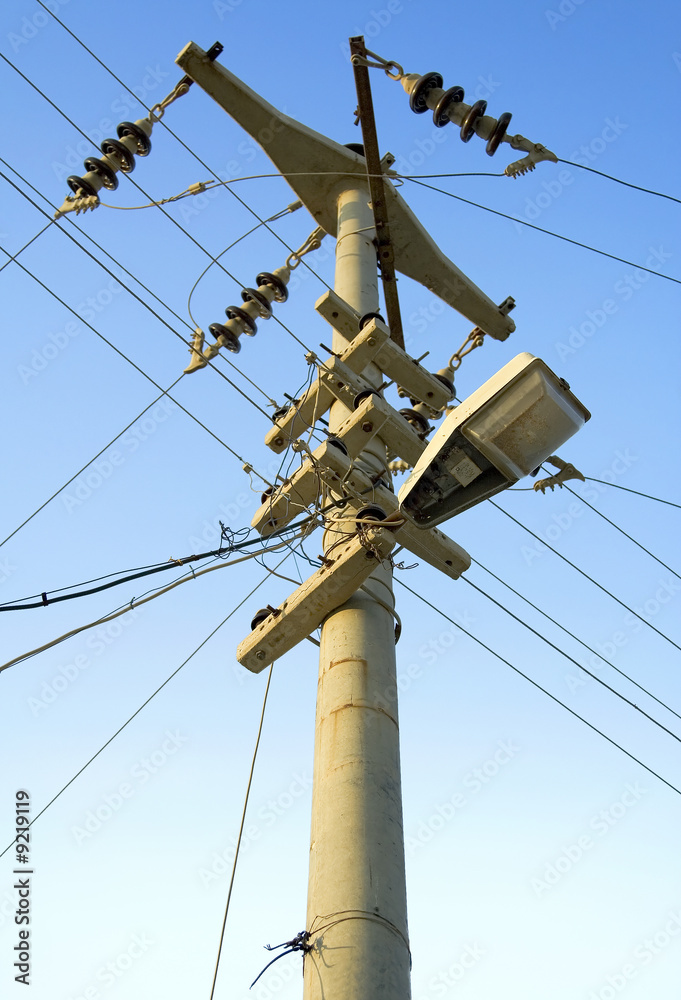 A dangerously manufactured electric pole with a street lamp. A dangerously manufactured electric pole with a street lamp.
