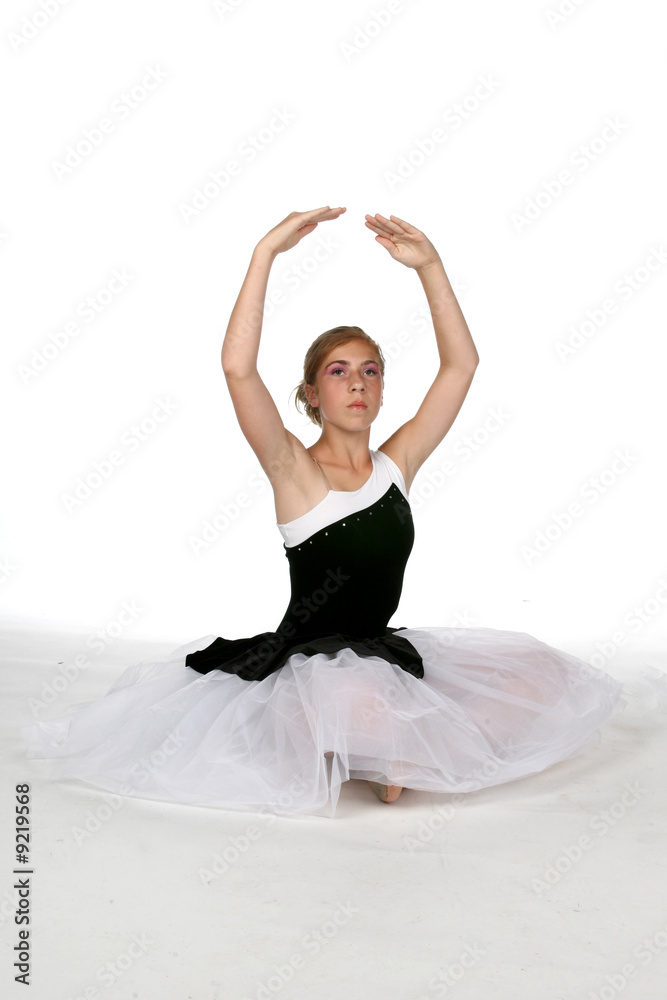 Fototapeta premium ballerina with arms extended into fifth position
