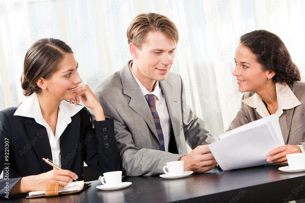 Portrait of business team interacting with each other Portrait of business team interacting with each other
