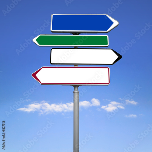 A blank road sign in different colours against a blue sky. © RTimages