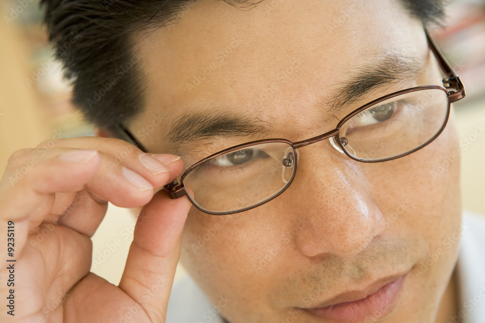 Man Looking Through New Glasses Man Looking Through New Glasses