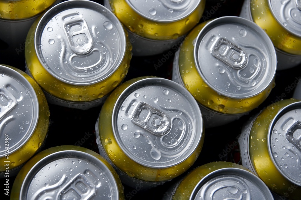 Cans of beer with condensation droplets Cans of beer with condensation droplets