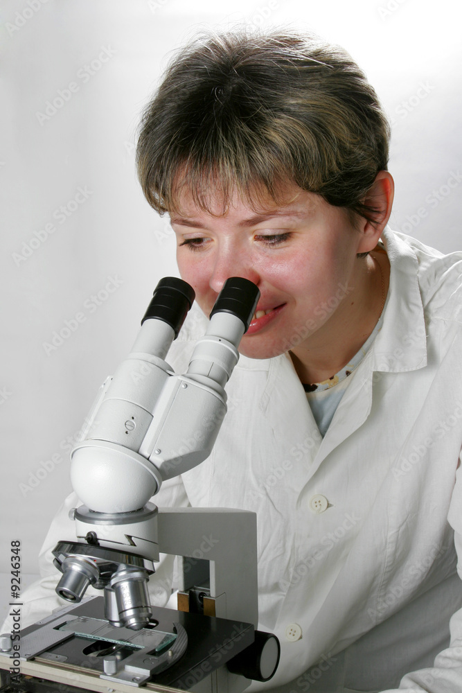Scientist and microscope Scientist and microscope