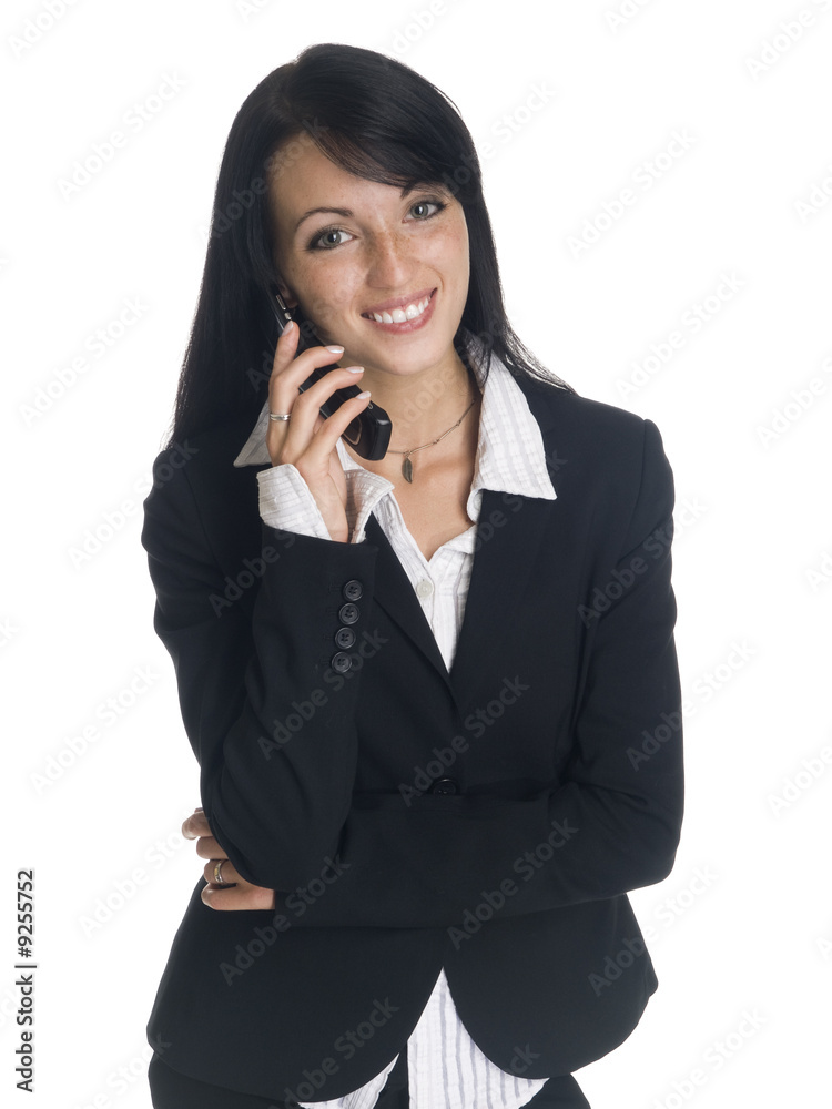 businesswoman smiling while talking on her cell phone. businesswoman smiling while talking on her cell phone.