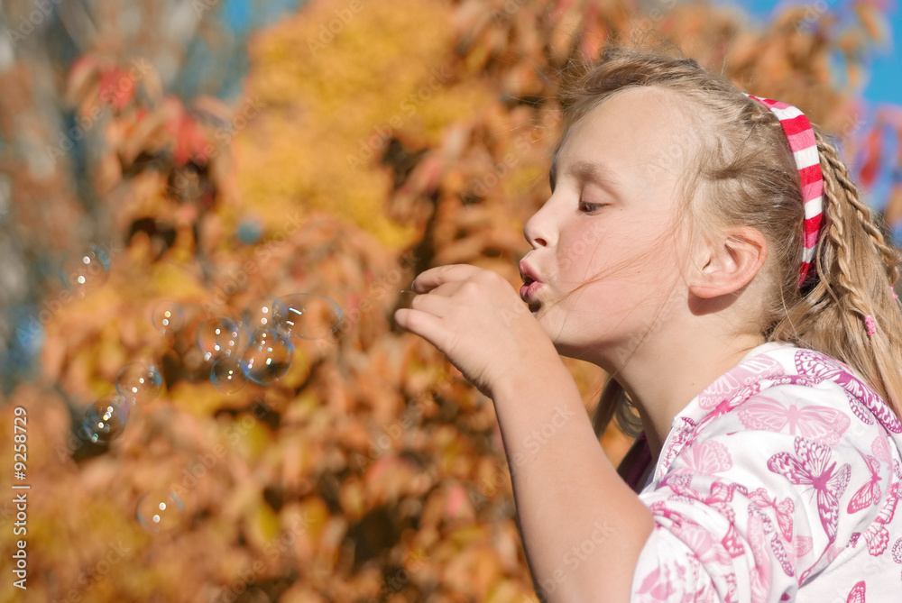 young girl sends her wishes with these bubbles young girl sends her wishes with these bubbles