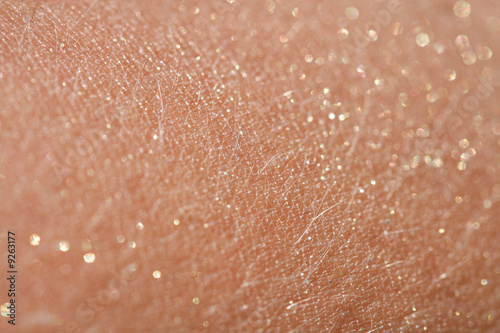 human skin background with glitter sparkles dust