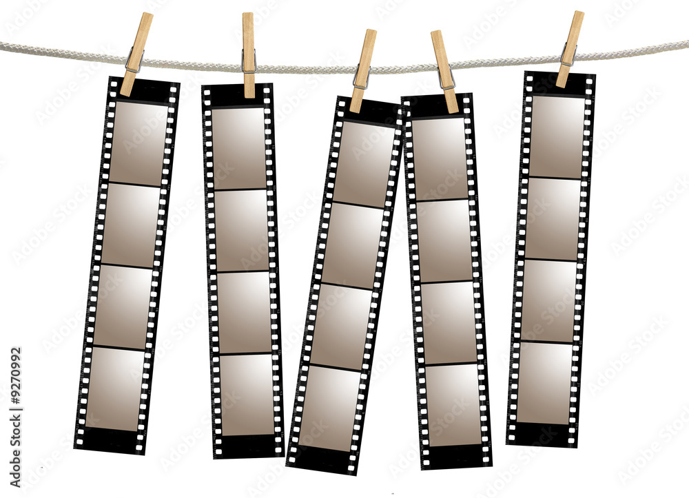 Naklejka premium Blank 35mm Film Strip Negatives Hanging From A Rope