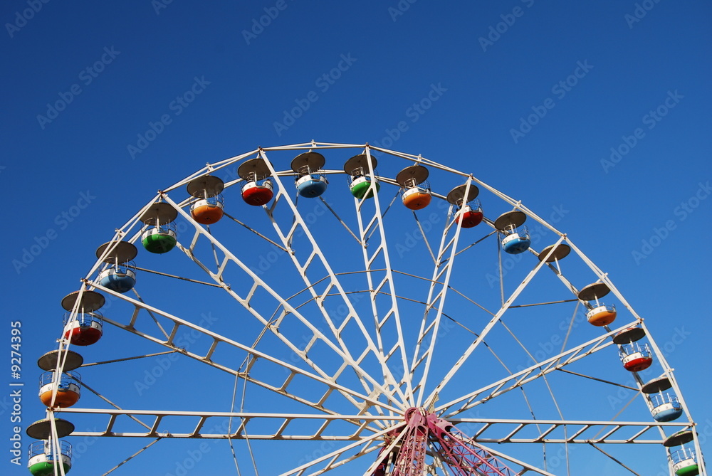Ferris wheel on background blue sky Ferris wheel on background blue sky