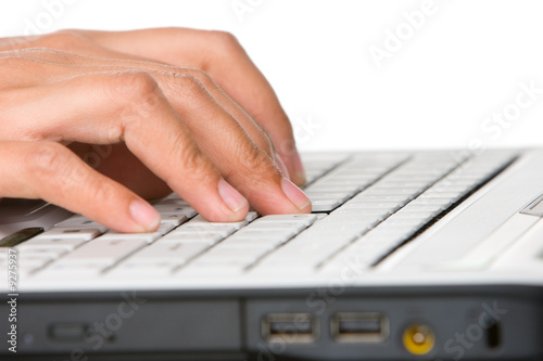 Typing on laptop