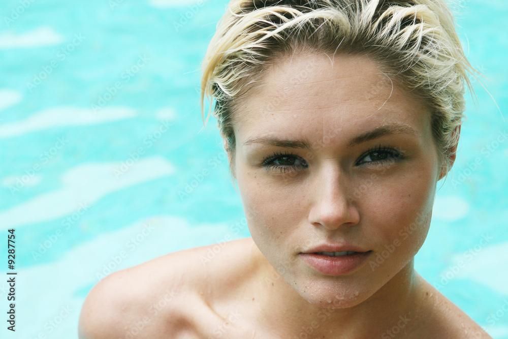 Portrait of a gorgeous blond woman in the swimming pool. Portrait of a gorgeous blond woman in the swimming pool.