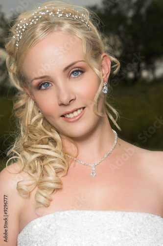 Beautiful Blond bride wearing diamond jewelery