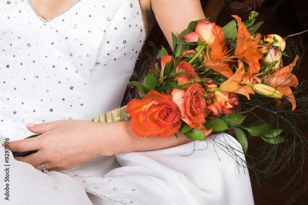 Bride holding a floral bouquet on her wedding day Bride holding a floral bouquet on her wedding day