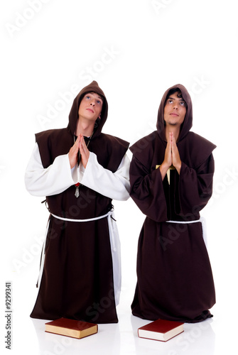 Holiday Halloween scene, two priests in habit praying.