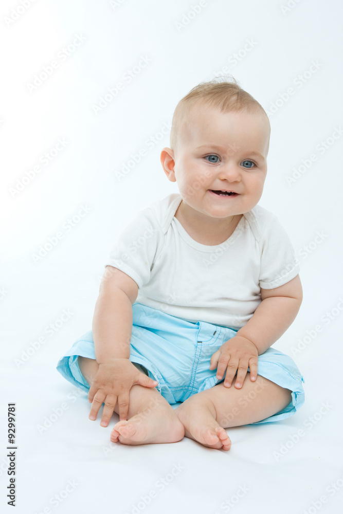 cute laughing baby boy sitting on white background cute laughing baby boy sitting on white background