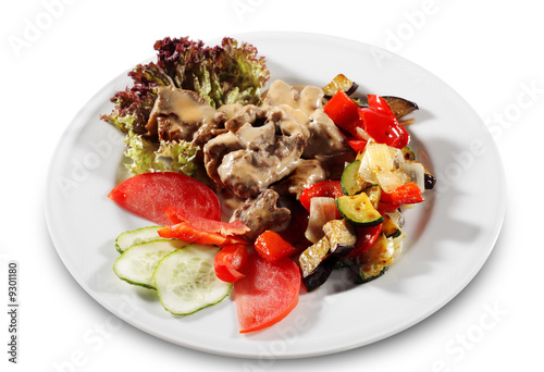 Stewed Beef with Vegetables and Fresh Vegetable on Plate