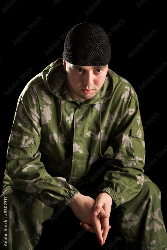 Fototapeta premium Young handsome man on black isolated background