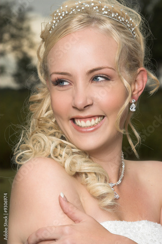 Beautiful Blond bride wearing diamond jewelery