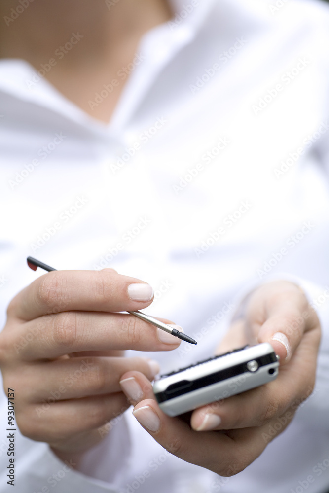 Fototapeta premium Woman using palmtop, close-up