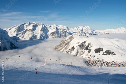 High mountains with ski tracks and ski lifts © Gudellaphoto