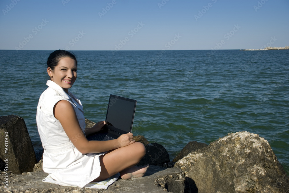 Young women working on her laptop