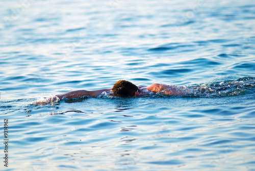 swimming man in ocean water © Iakov Kalinin