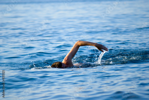 swimming man in ocean water © Iakov Kalinin