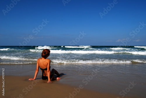 Woman on the beautiful beach of sea