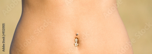 Young female torso with piercing