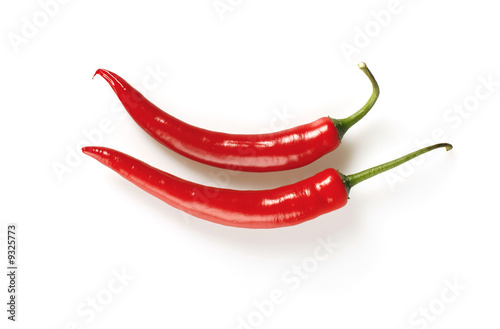 Isolated shot of red hot chilli peppers on white background