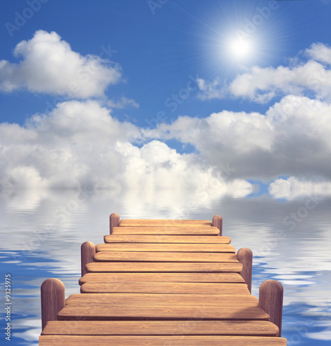 The wooden mooring covered by the sun