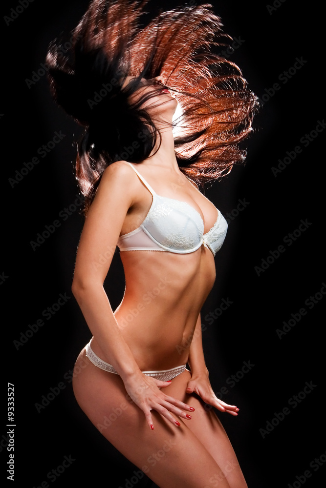 Obraz premium sexy woman in lingerie dancing on the black background