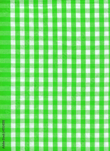 Background from a natural fabric in a green and white cell