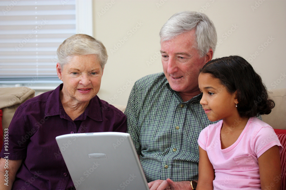 Grandparents together with their family at home Grandparents together with their family at home